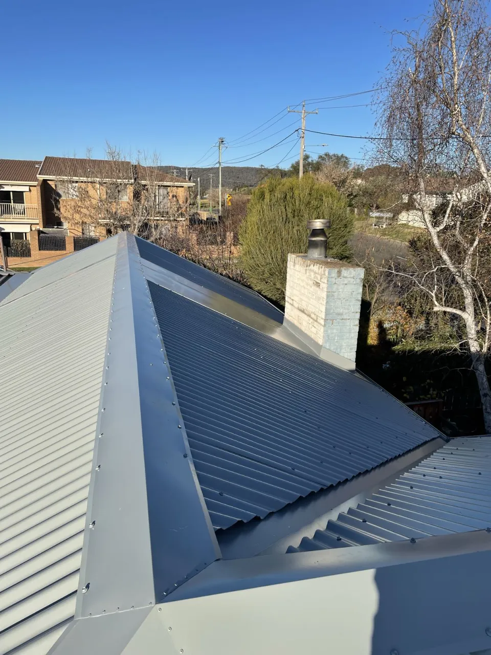 New COLORBOND corrugated roof sheeting and ridge capping on the Oaks Estate home