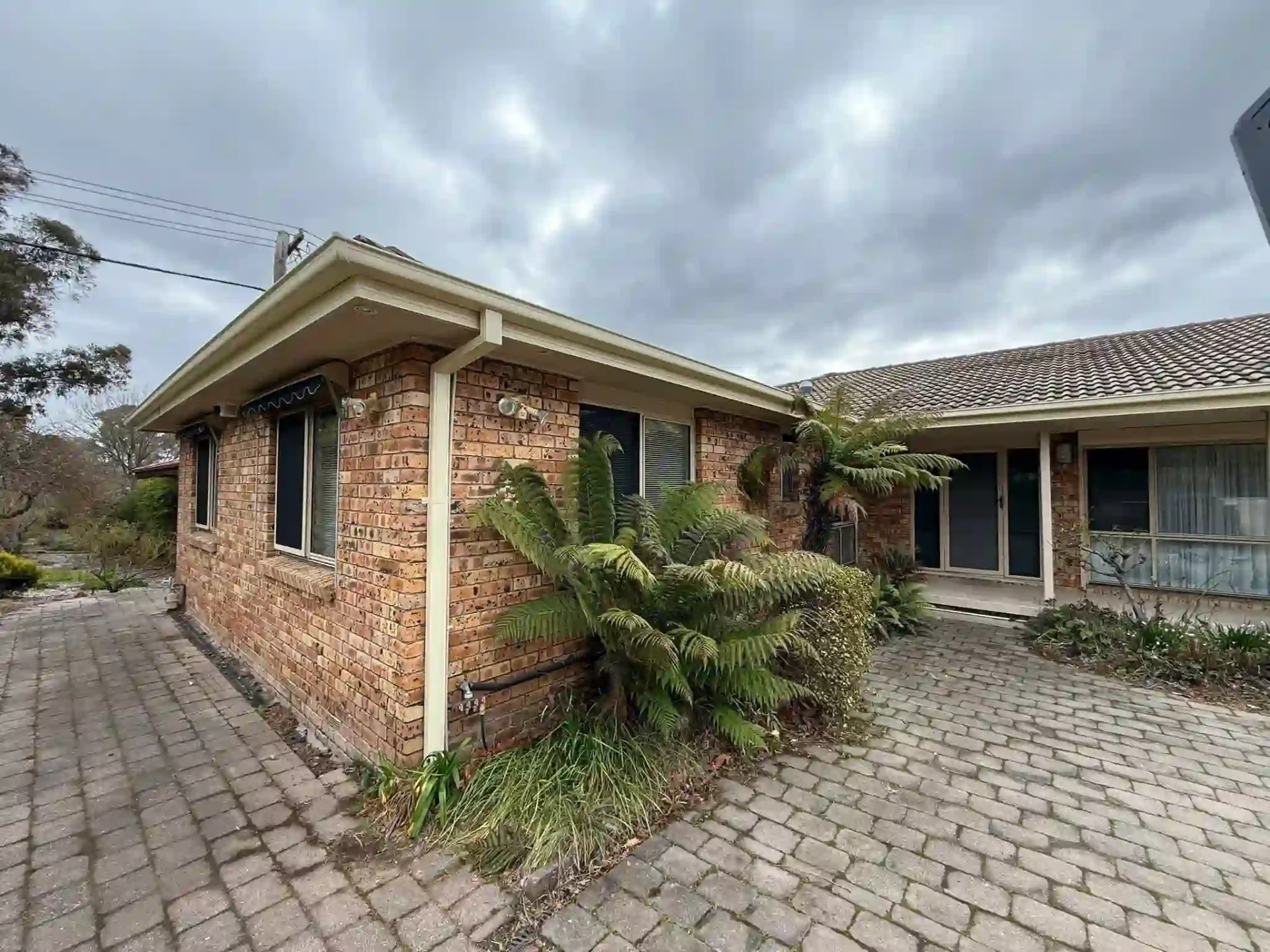 Wanniassa brick home with new fascia covers and guttering along the roofline